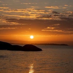 A tranquil view of still water reflecting the sky.